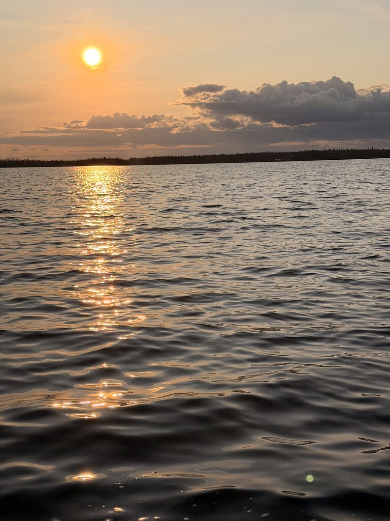 The sun setting over Besnard Lake
