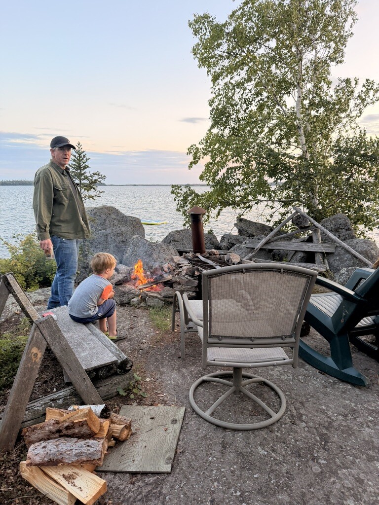 Family gathered around the evening fire