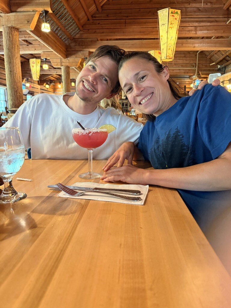 Family enjoying lunch inside Lake McDonald Lodge