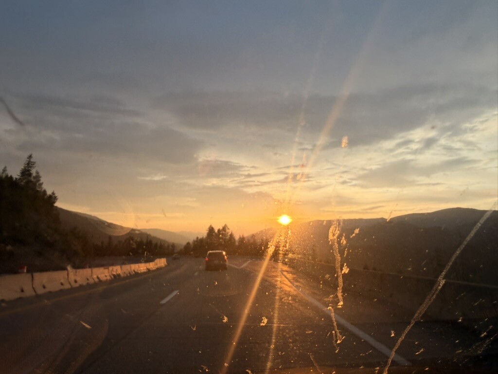 The final sunset of the trip through a car windshield