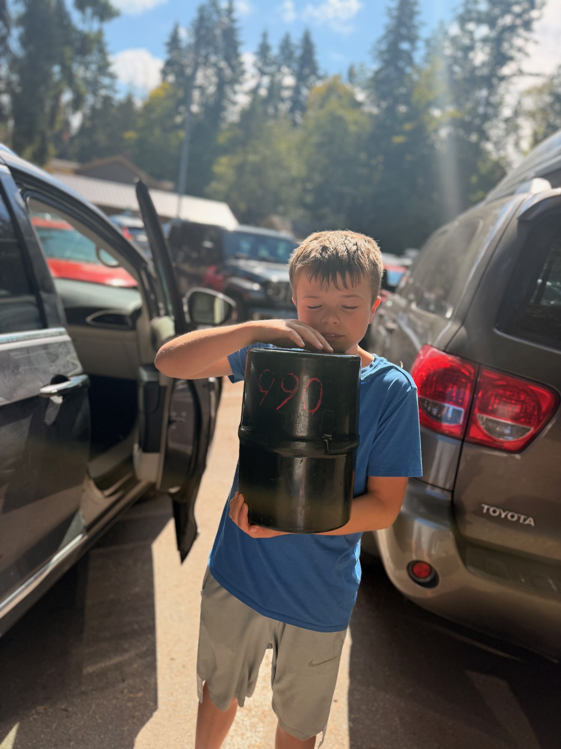 Birch carrying a black bear canister in Port Angeles