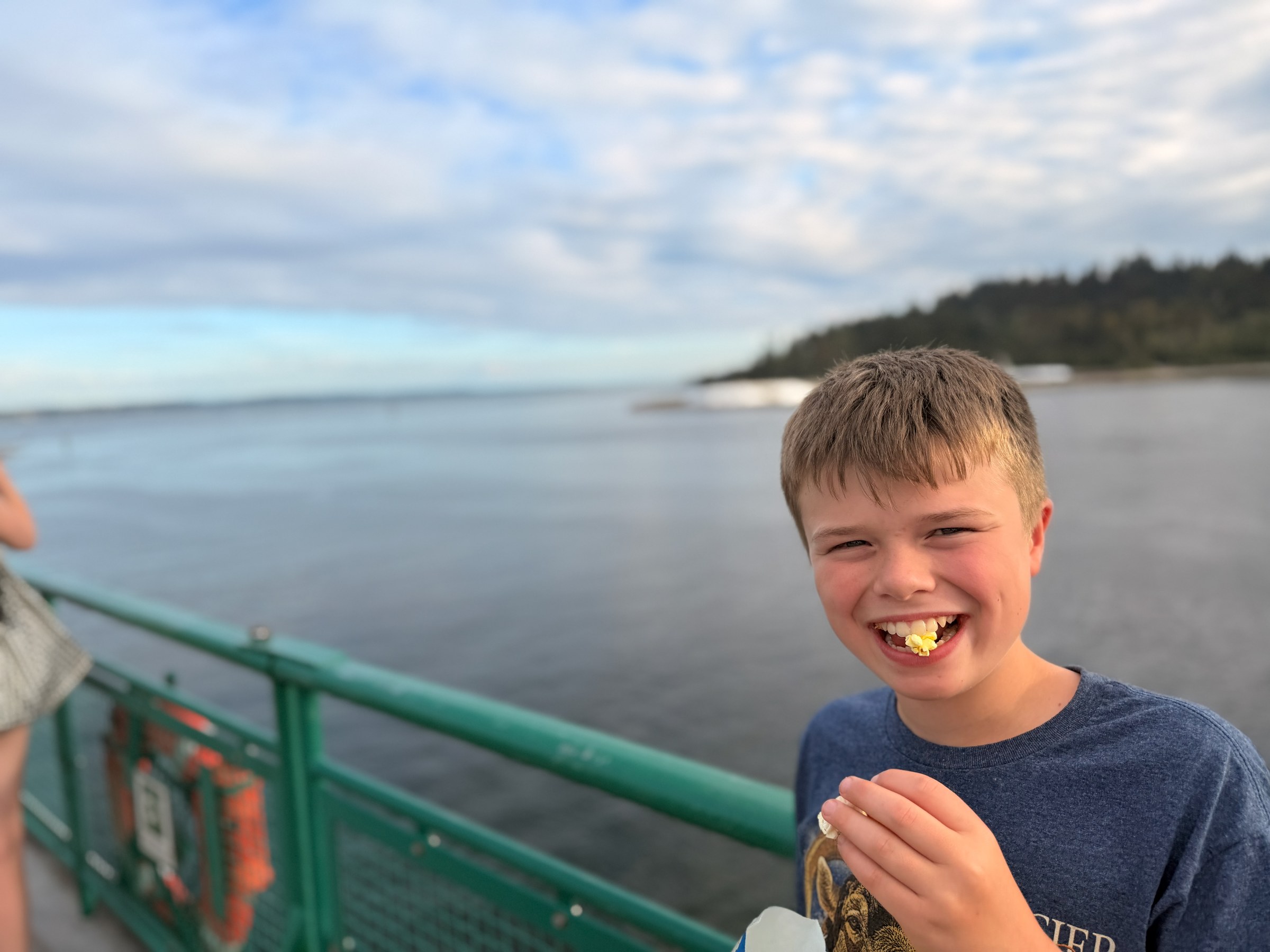 Birch eating popcorn on the Bainbridge ferry home