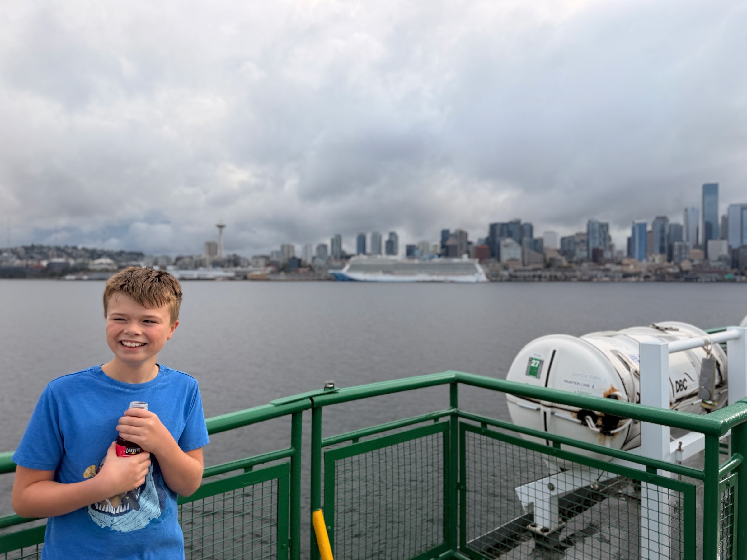Birch on the Seattle–Bainbridge ferry with the Seattle skyline behind him