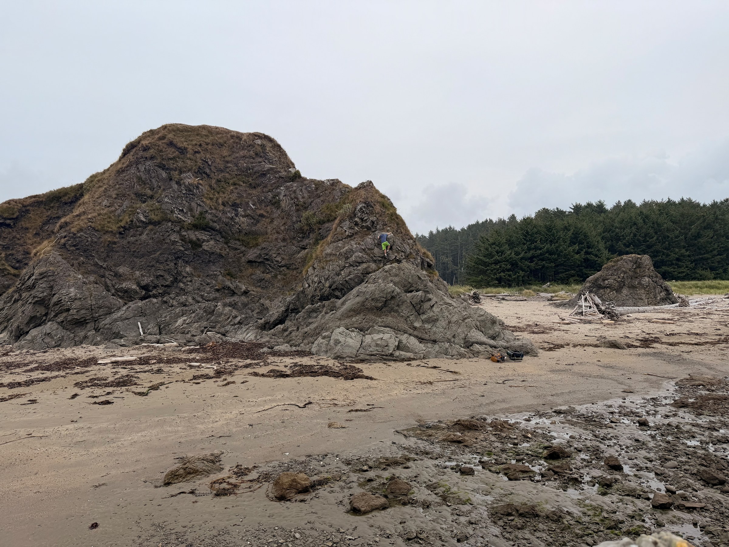 The large rocky hill at Sand Point Beach