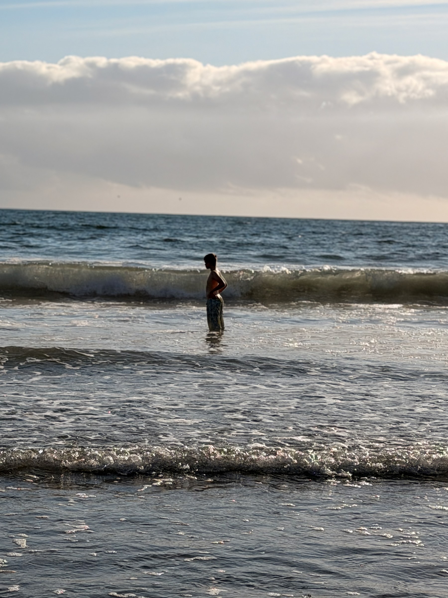 Birch standing in a breaking wave at South Sand Point