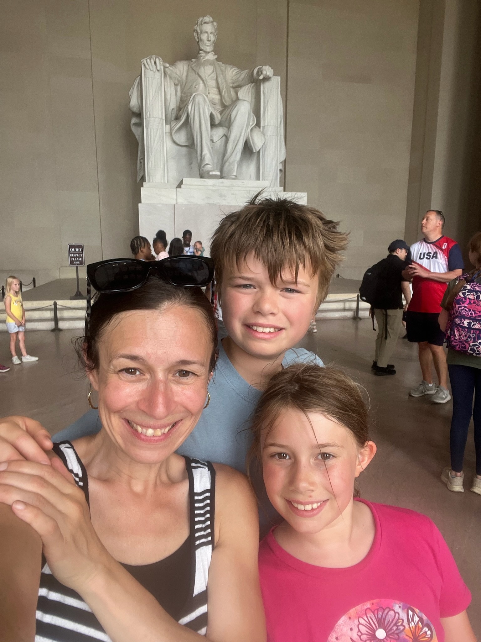 A family selfie inside the Lincoln Memorial