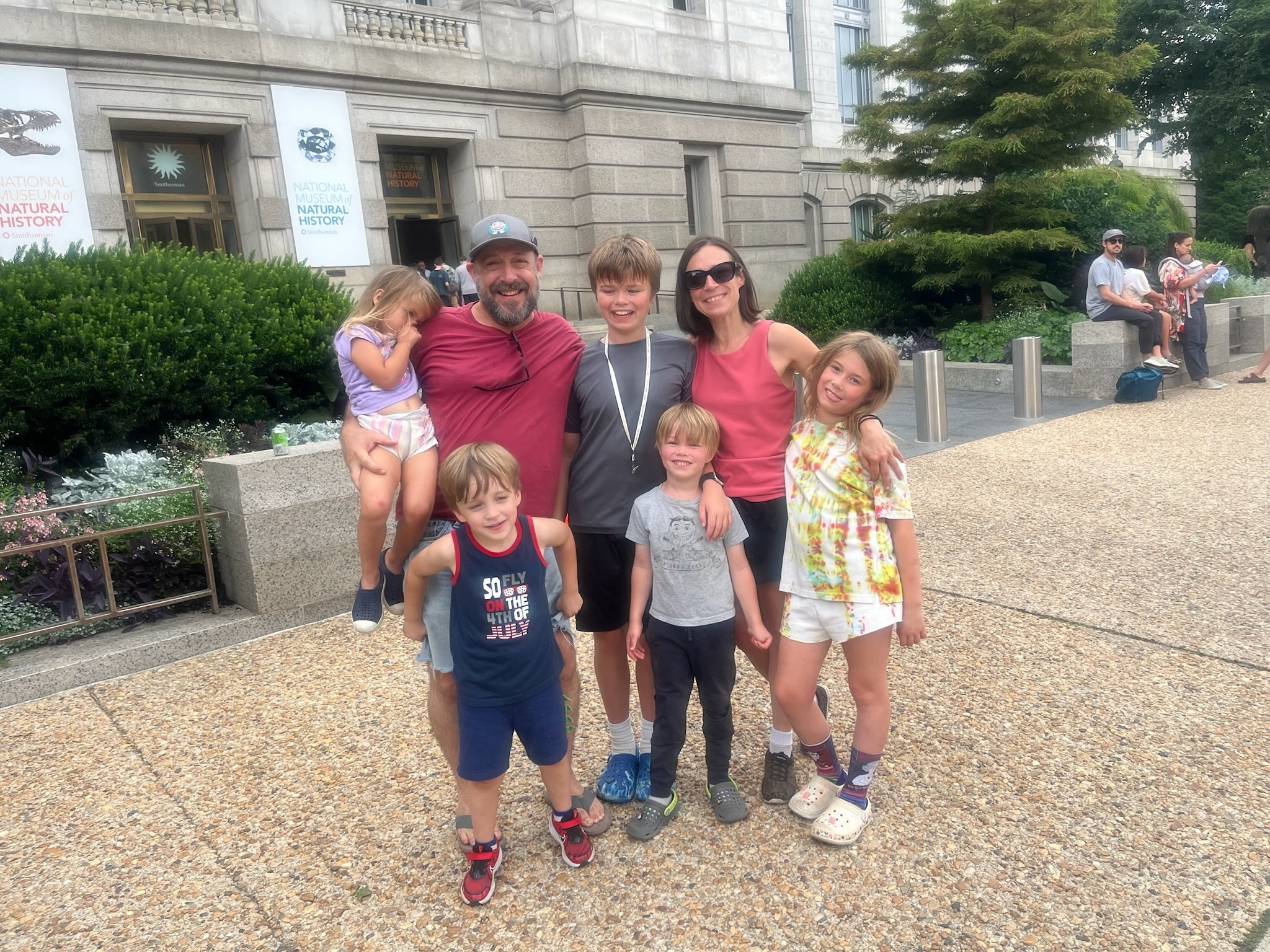 The extended family gathered outside the National Museum of Natural History